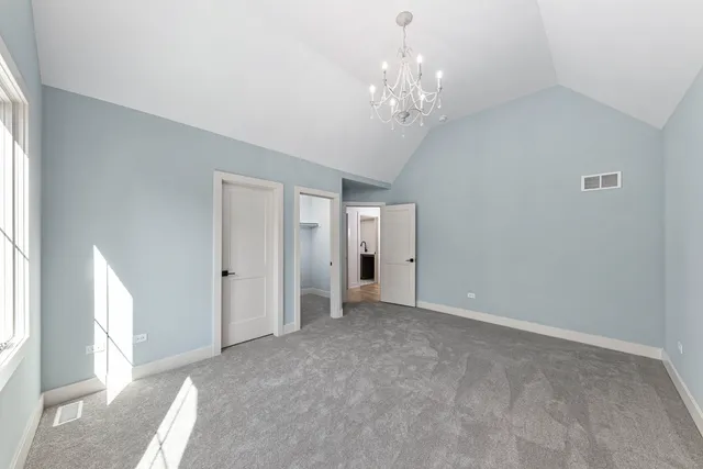a view of a bathroom with a sink and a mirror