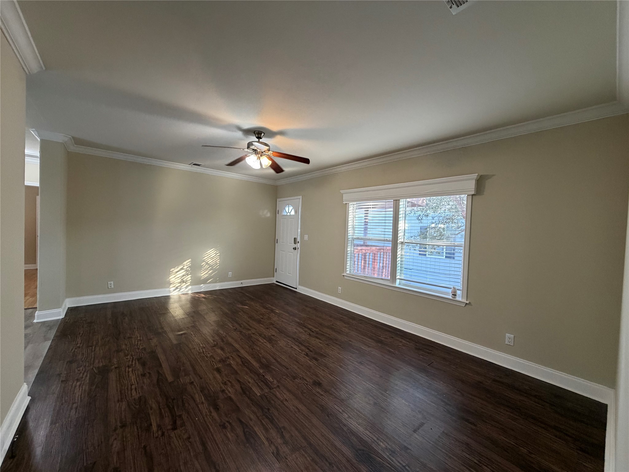 13021 Dessau Road, Unit 393 Austin, TX 78754 - Photo 3 of 10 Rich hardwood floors complement the crisp crown molding and wide windows in this versatile living space.