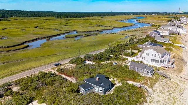 a view of a lake with houses in the back