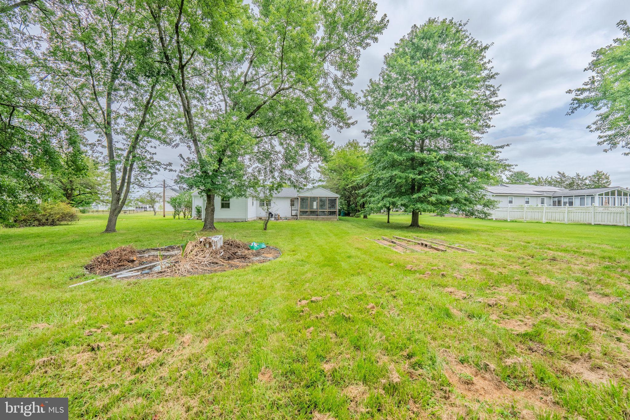 66 Rocky Ridge Road Quakertown, PA 18951 - Photo 29 of 42 Spacious backyard oasis with lush greenery.