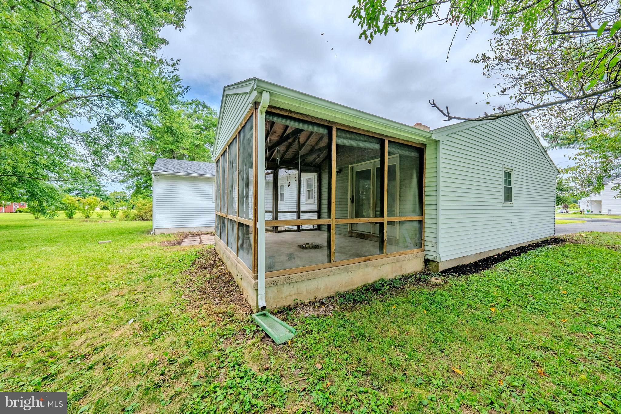 66 Rocky Ridge Road Quakertown, PA 18951 - Photo 34 of 42 Charming screened porch in a serene setting.