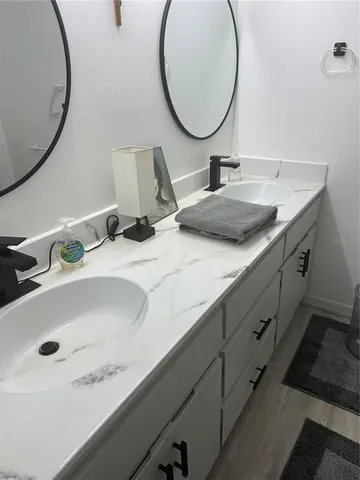 a bathroom with a glass door shower and toilet