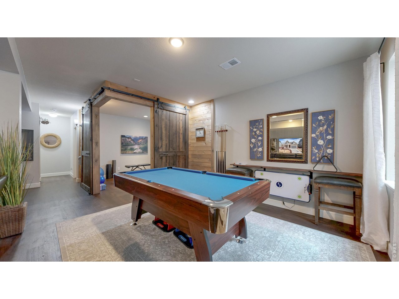 6820 Rainier Road Timnath, CO 80547 - Photo 24 of 50 Entertainment room with Flex Room which include Barn Doors!