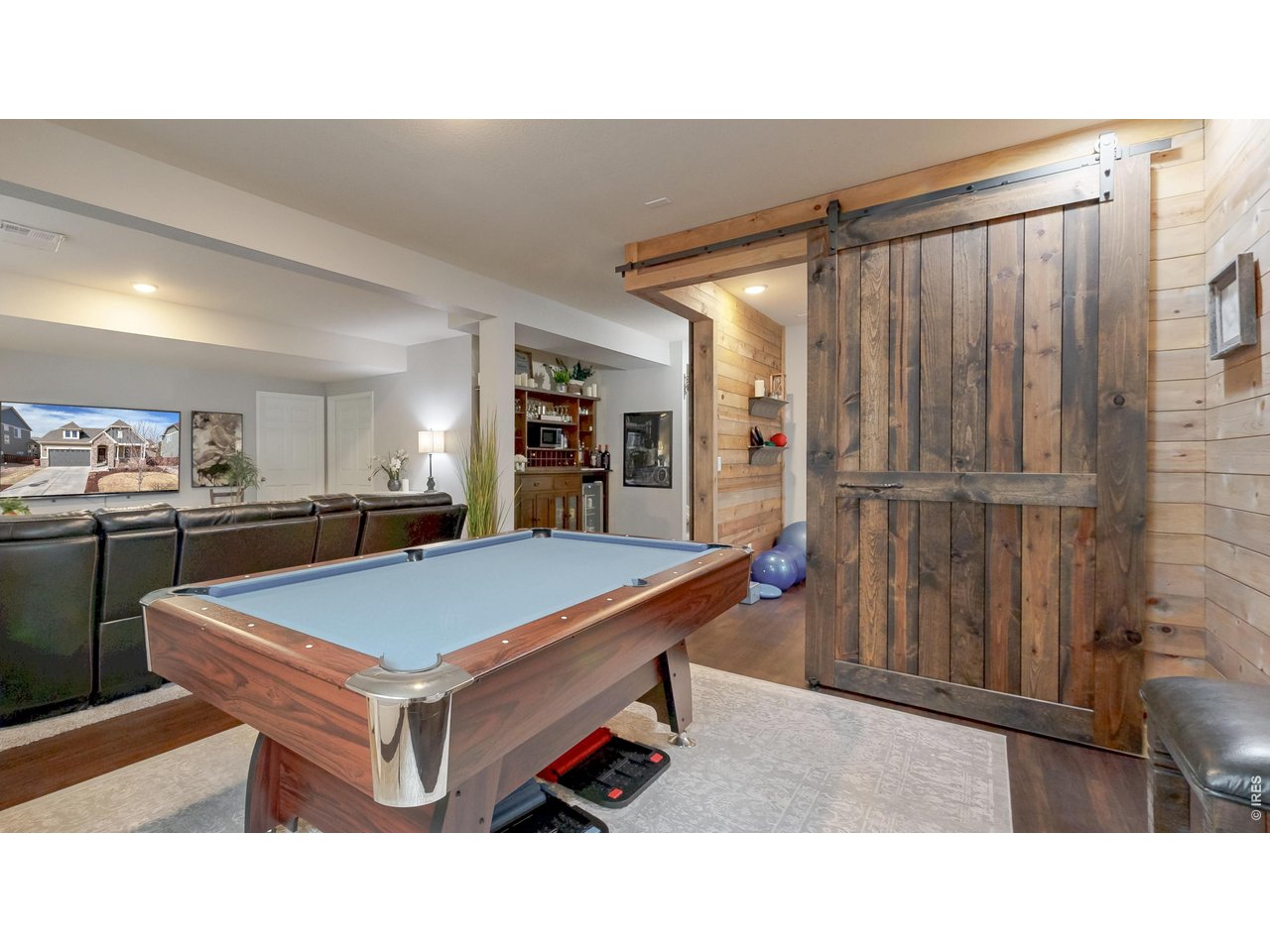 6820 Rainier Road Timnath, CO 80547 - Photo 25 of 50 Barn Doors open & close to create an amazing Flex Room!