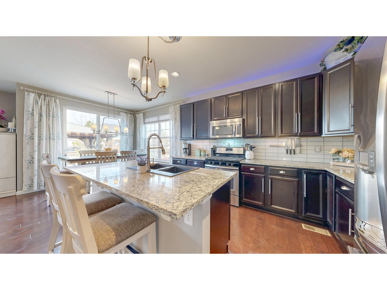 6820 Rainier Road Timnath, CO 80547 - Photo 3 of 50 Awesome Gourmet Kitchen with Quartz Countertops!