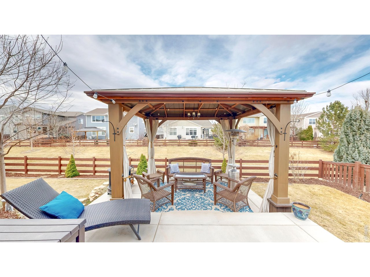 6820 Rainier Road Timnath, CO 80547 - Photo 32 of 50 Oversized Patio opens to Covered Pergola!