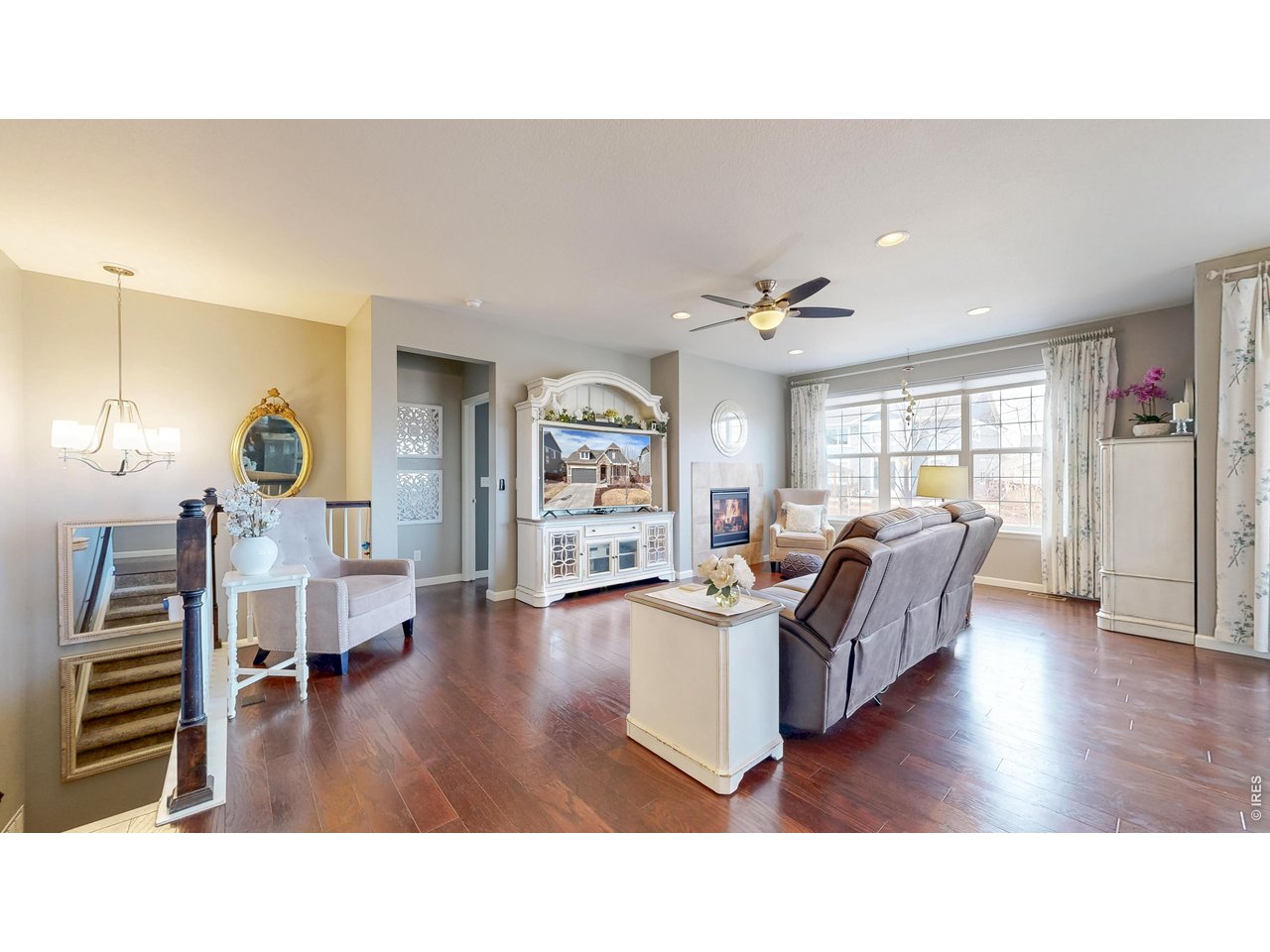 6820 Rainier Road Timnath, CO 80547 - Photo 4 of 50 Spacious Great Room, with Engineered Wood Floors and Gas Fireplace!