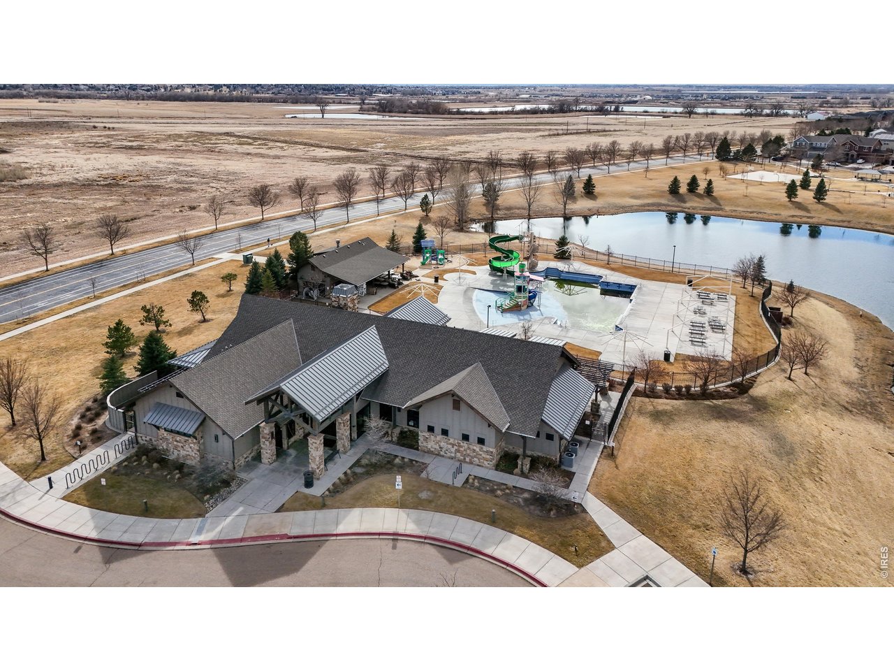 6820 Rainier Road Timnath, CO 80547 - Photo 44 of 50 Clubhouse, pickle ball, tennis courts, pool, trails and lakes make up this fabulous neighborhood!