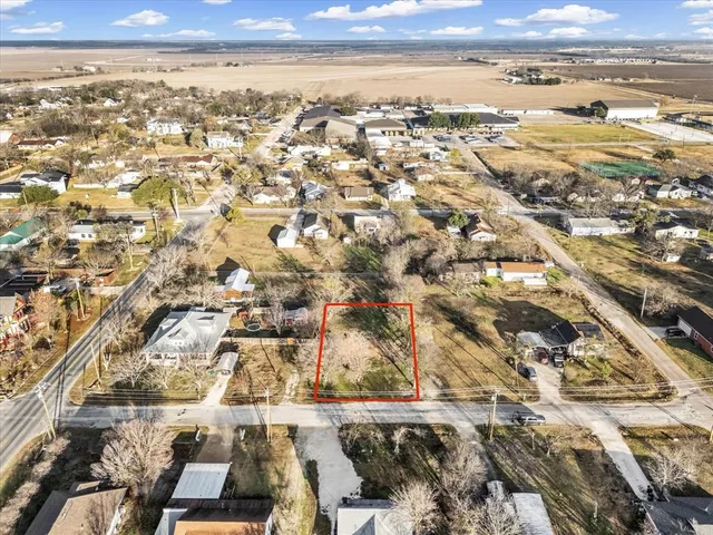 an aerial view of residential building and ocean view