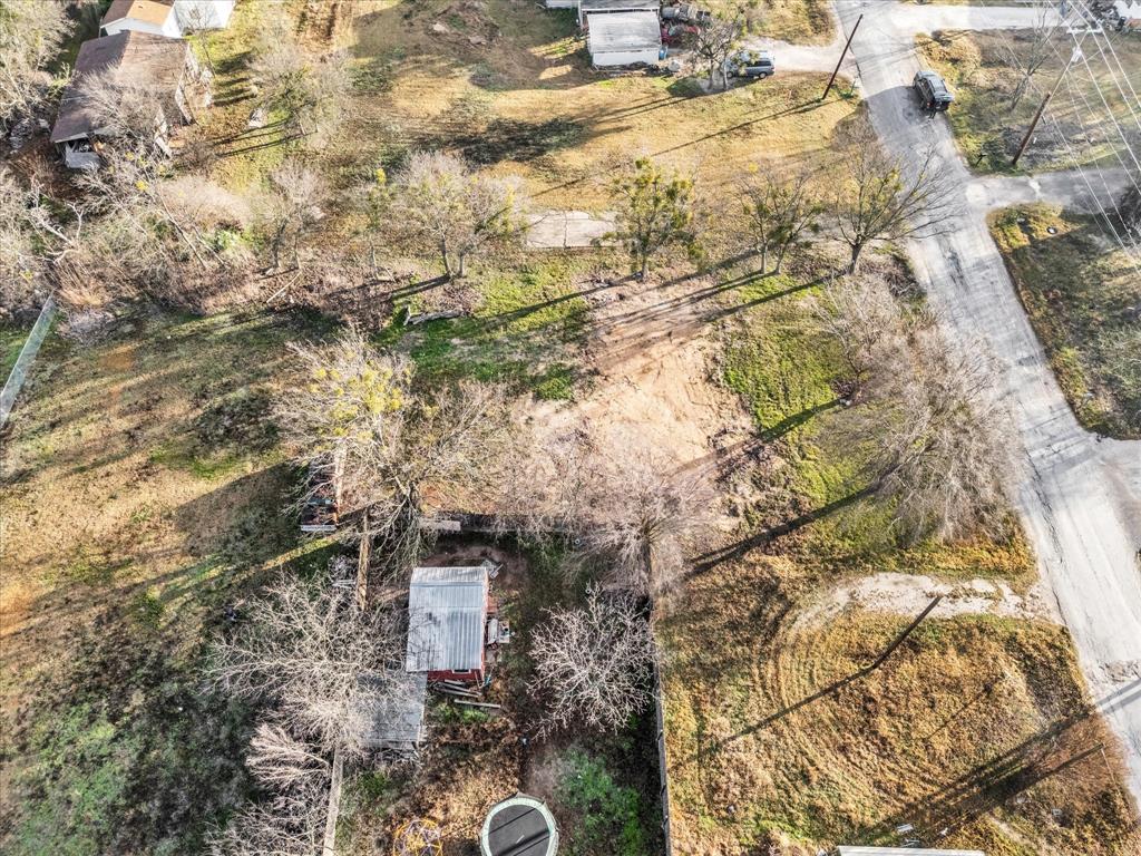 605 East Adams Street Itasca, TX 76055 - Photo 11 of 23 a aerial view of a house with a yard