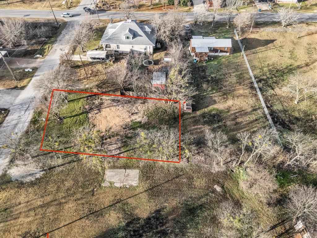 605 East Adams Street Itasca, TX 76055 - Photo 19 of 23 an aerial view of residential houses with outdoor space