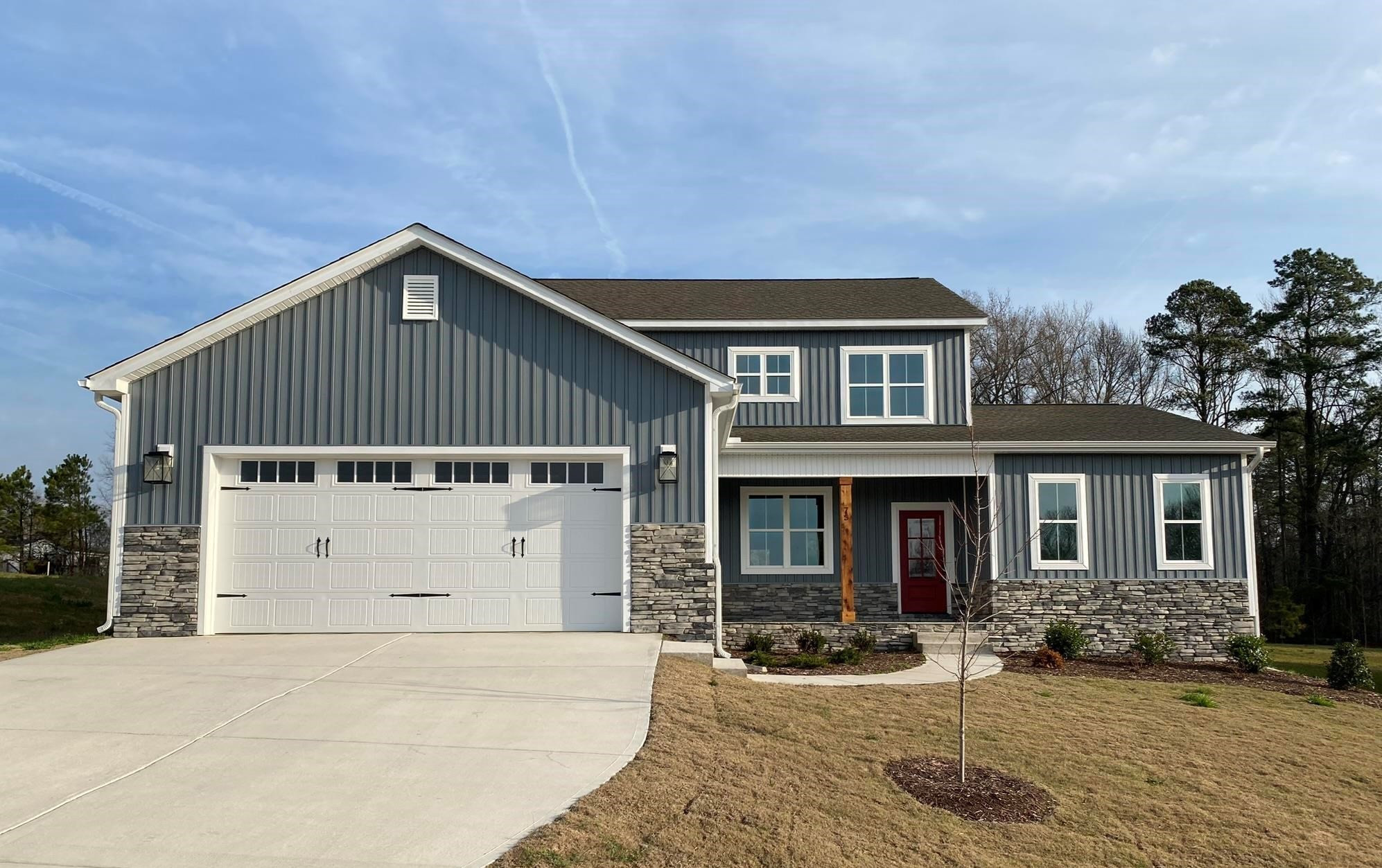 75 Buckstone Place Willow Spring, NC 27592 - Photo 1 of 32 a front view of a house with garden