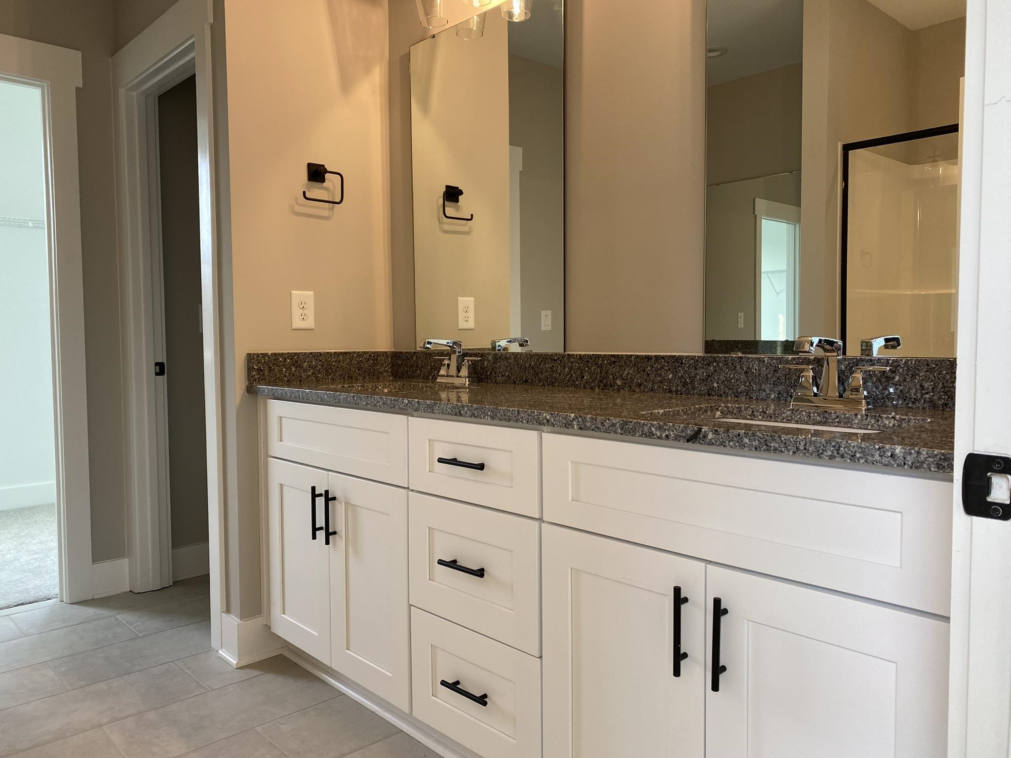 75 Buckstone Place Willow Spring, NC 27592 - Photo 13 of 32 a bathroom with a granite countertop sink and a mirror