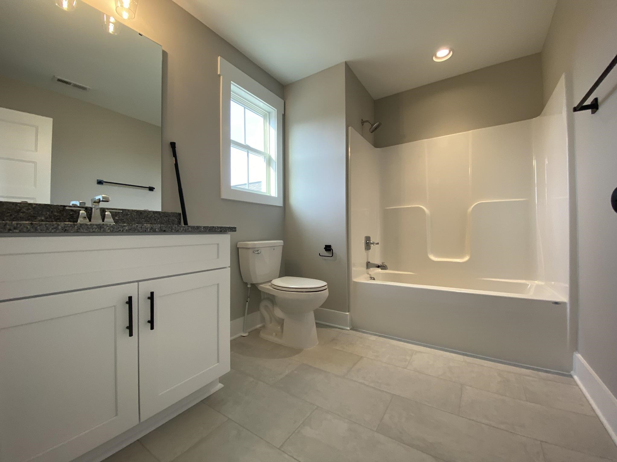 75 Buckstone Place Willow Spring, NC 27592 - Photo 23 of 32 a bathroom with a granite countertop sink toilet and shower