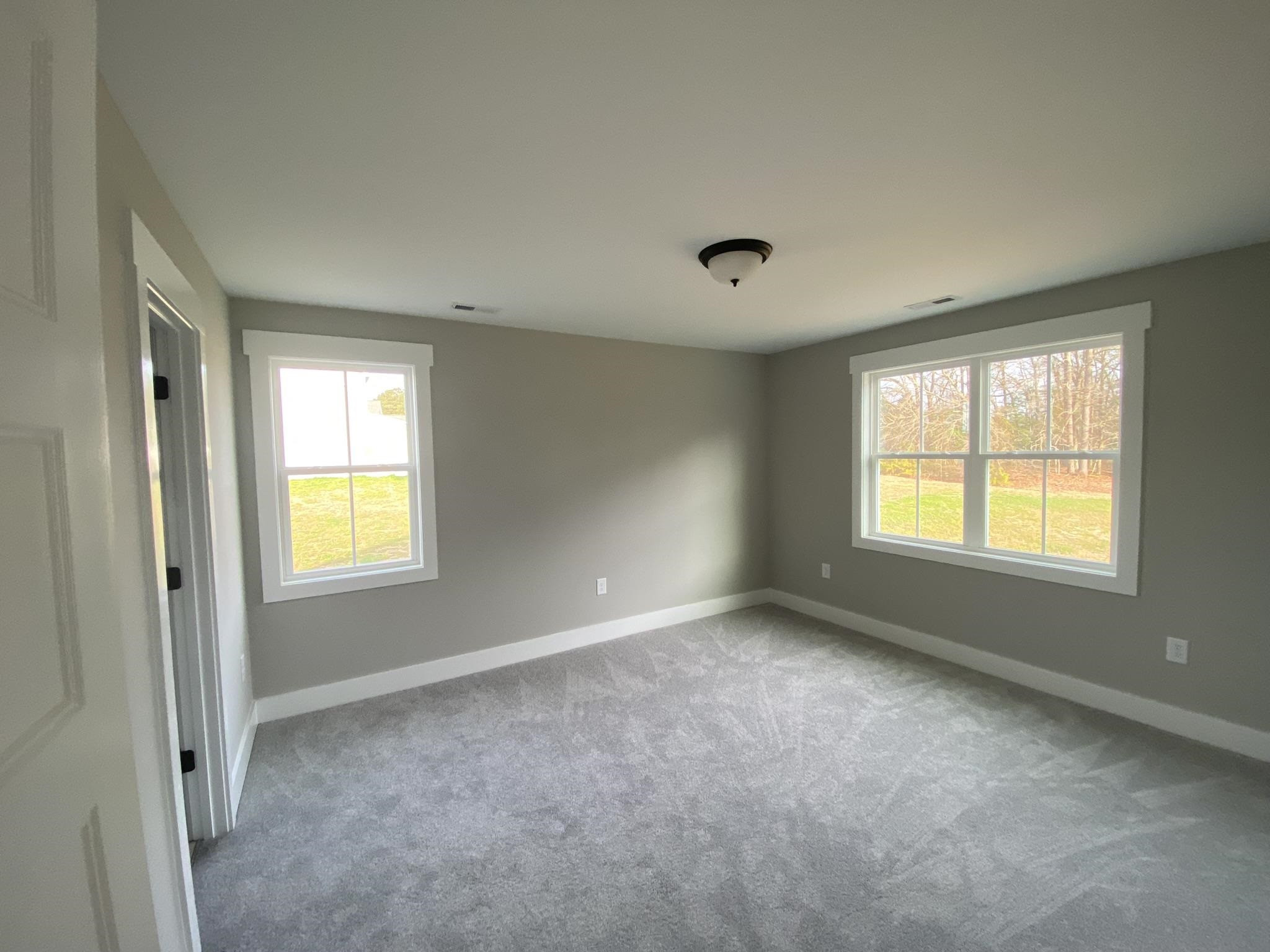 75 Buckstone Place Willow Spring, NC 27592 - Photo 25 of 32 a view of an empty room with a window