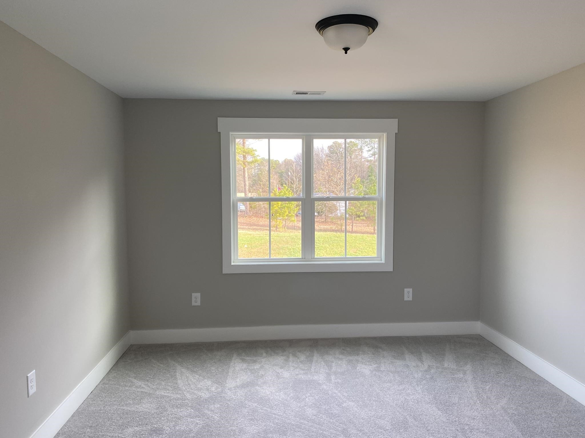 75 Buckstone Place Willow Spring, NC 27592 - Photo 26 of 32 an empty room with a window