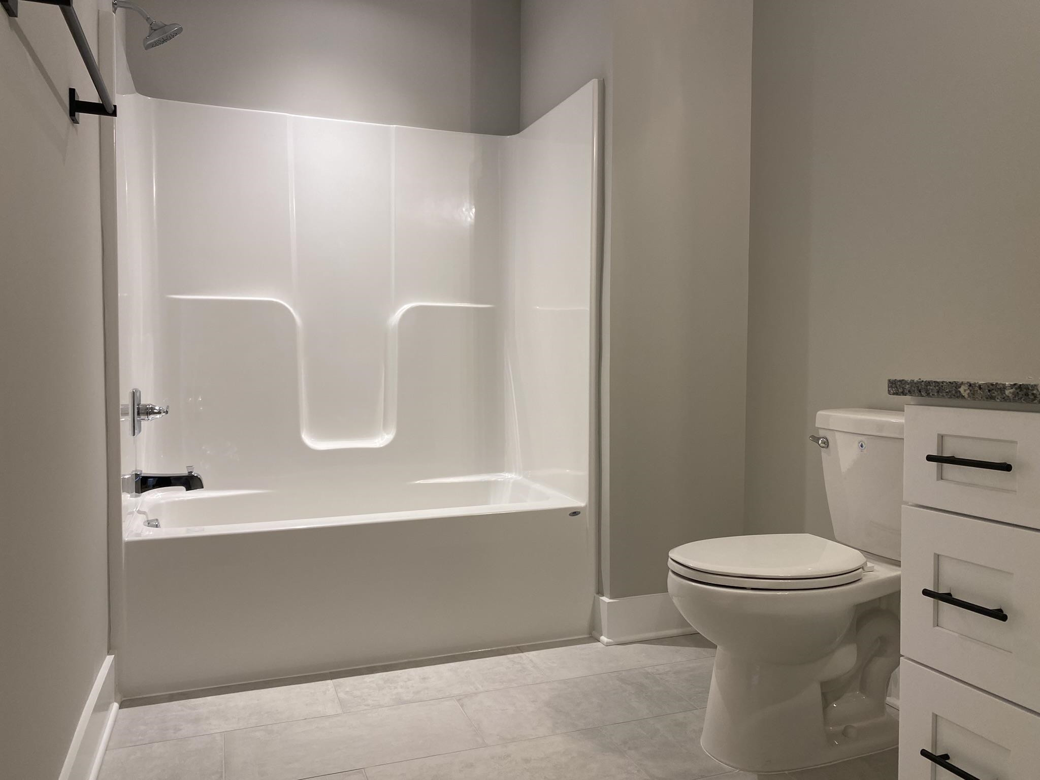 75 Buckstone Place Willow Spring, NC 27592 - Photo 28 of 32 a bathroom with a sink a toilet and a mirror