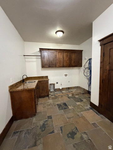 4536 North 475 East Provo, UT 84604 - Photo 59 of 65 Laundry room featuring a corner sink vanity with a stone countertop and dark wood cabinetry
