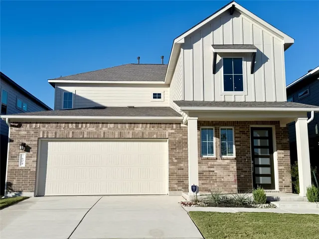 a view of a house with entrance gate