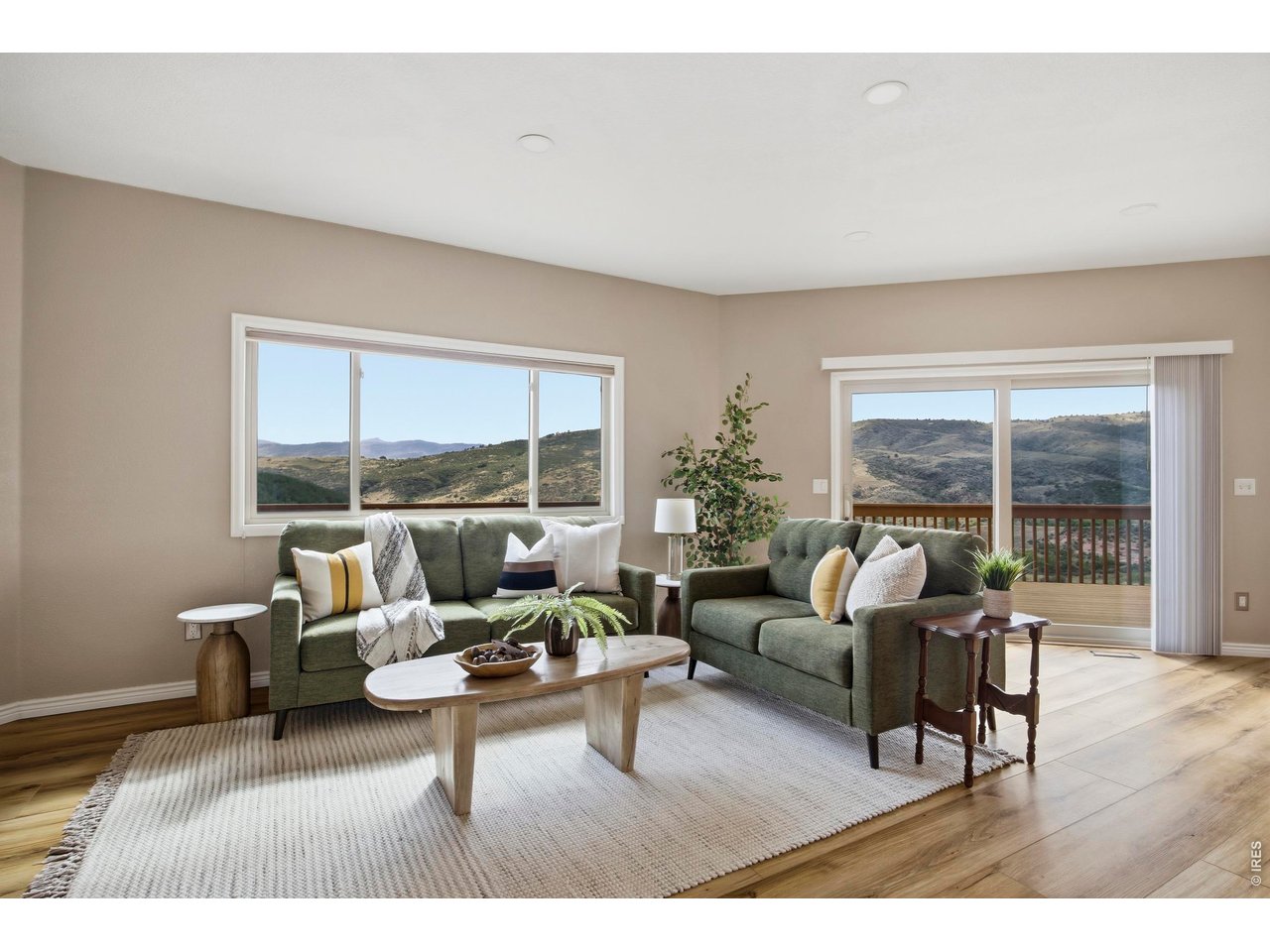 6925 Milner Mountain Ranch Road Fort Collins, CO 80526 - Photo 15 of 40 Immediate access to the wraparound deck invites effortless indoor-outdoor living with sweeping surroundings at every turn.
