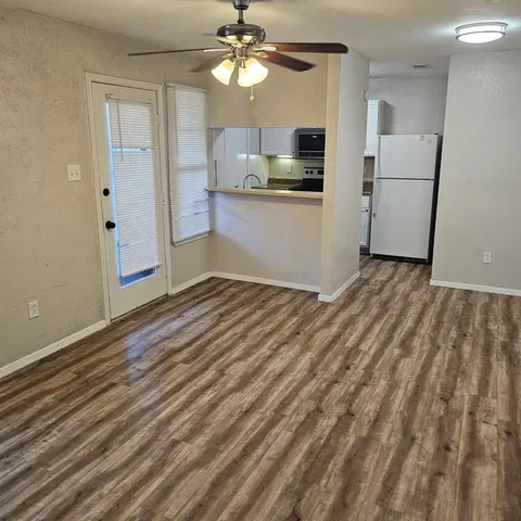 a view of a kitchen with a sink and cabinet area
