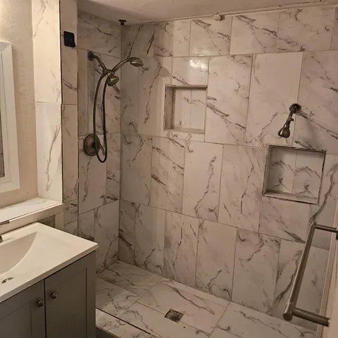 a bathroom with a sink and shower