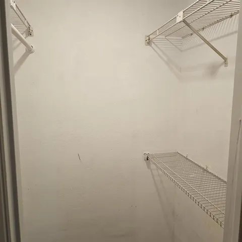 a view of small space with racks on the wall