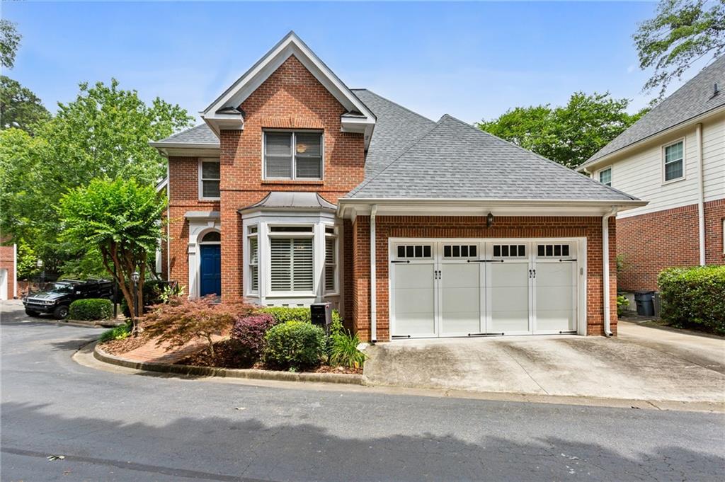 1104 Chantilly Crescent Northeast Atlanta, GA 30324 - Photo 1 of 1 a view of a house with a yard and potted plants