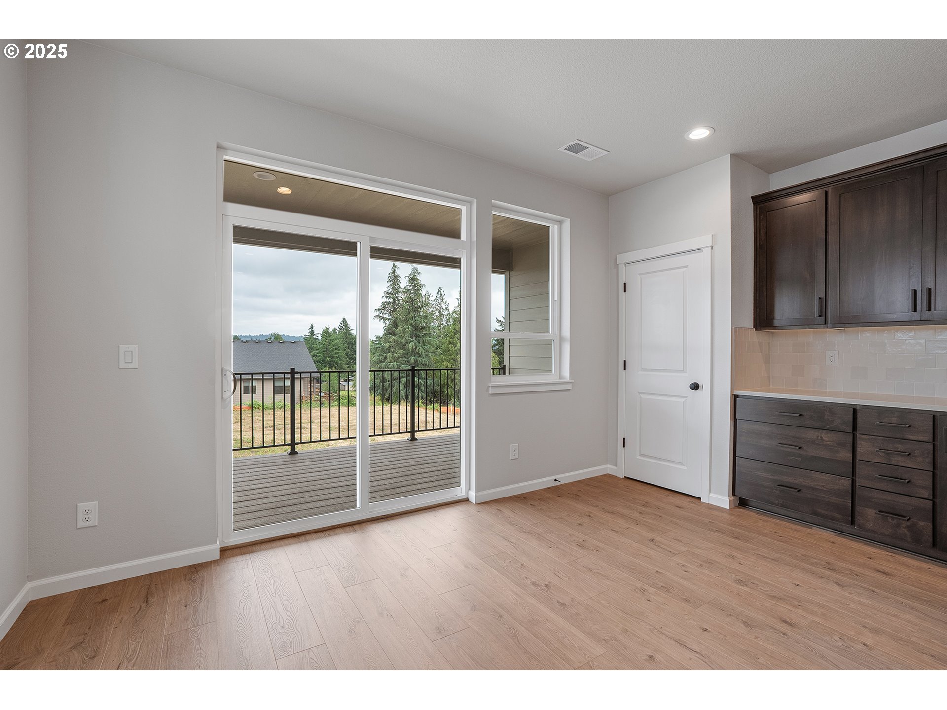 4652 Southeast 2nd Street Gresham, OR 97080 - Photo 11 of 30 a view of an empty room with wooden floor and a window
