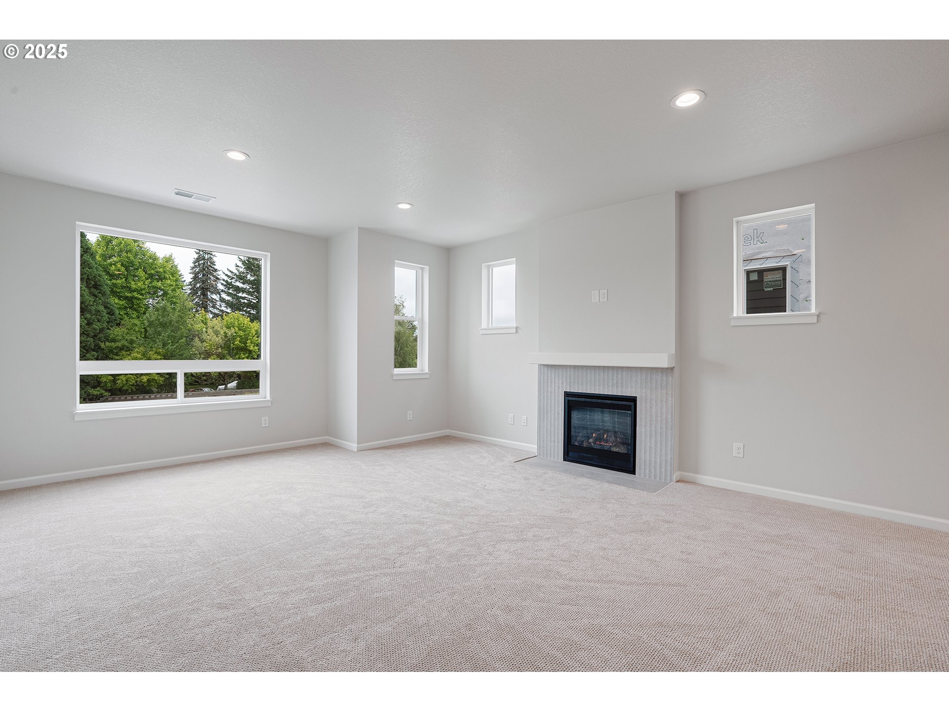 4652 Southeast 2nd Street Gresham, OR 97080 - Photo 14 of 30 a view of a livingroom with a fireplace and window