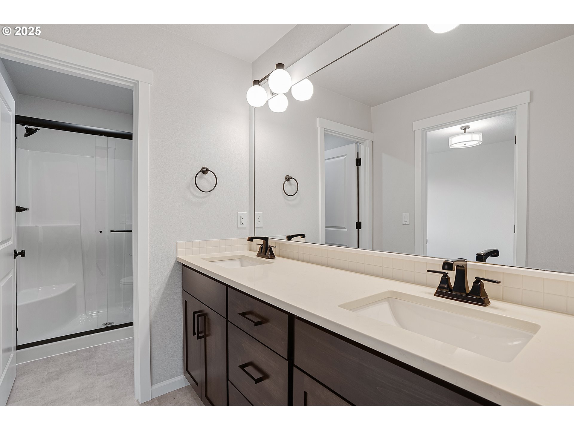 4652 Southeast 2nd Street Gresham, OR 97080 - Photo 19 of 30 a bathroom with a sink vanity granite and a mirror