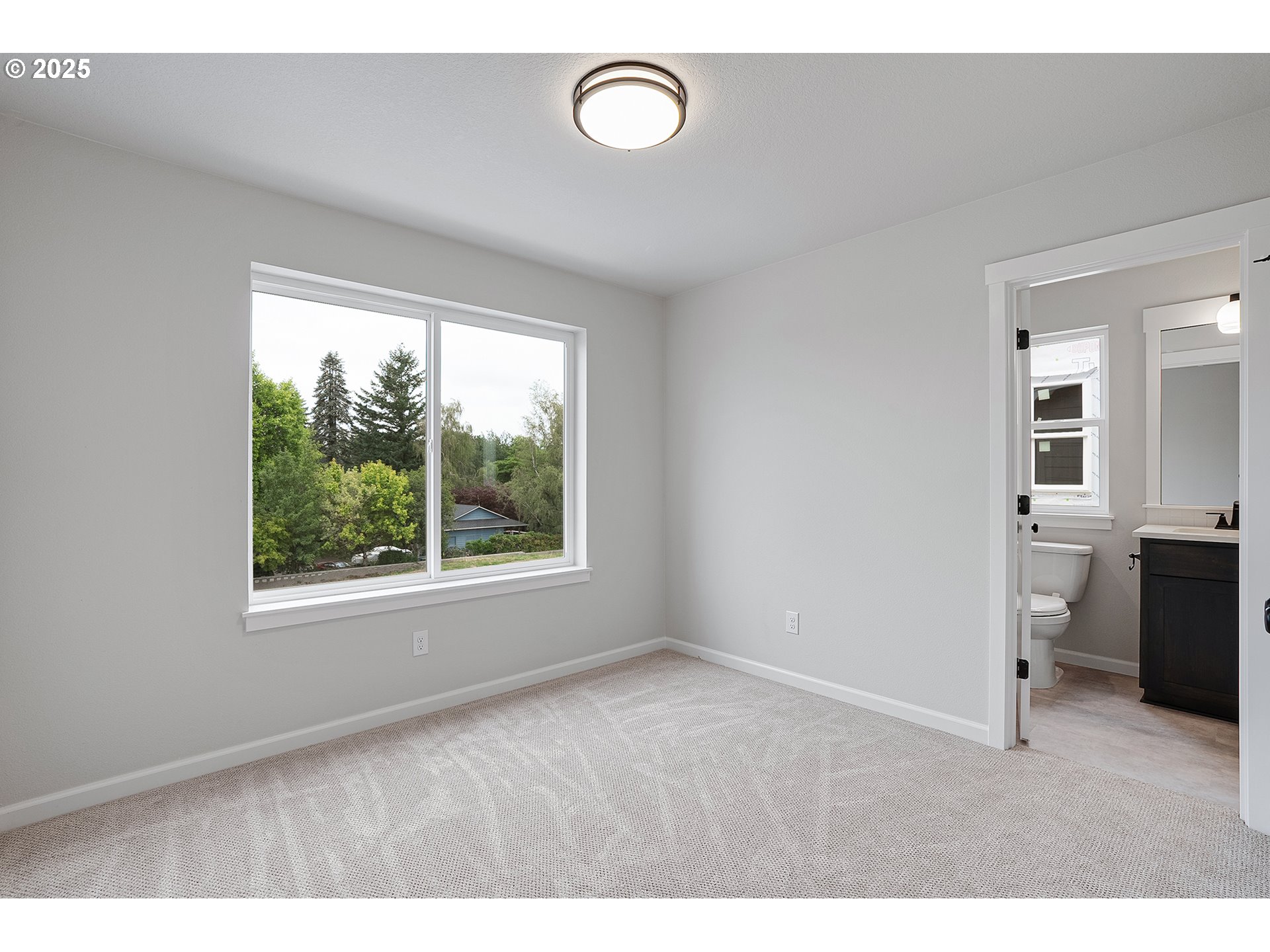 4652 Southeast 2nd Street Gresham, OR 97080 - Photo 24 of 30 a room with furniture and a window