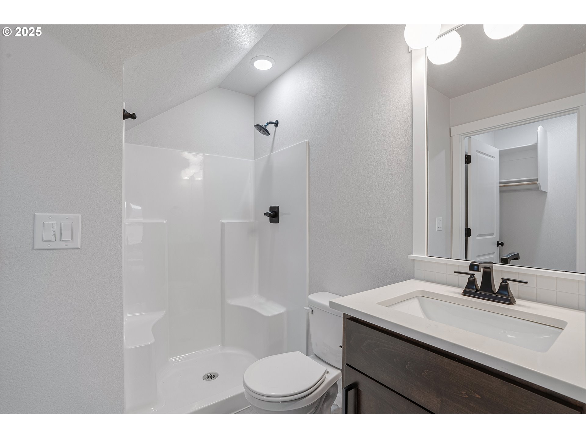 4652 Southeast 2nd Street Gresham, OR 97080 - Photo 6 of 30 a bathroom with a sink a toilet a mirror and shower