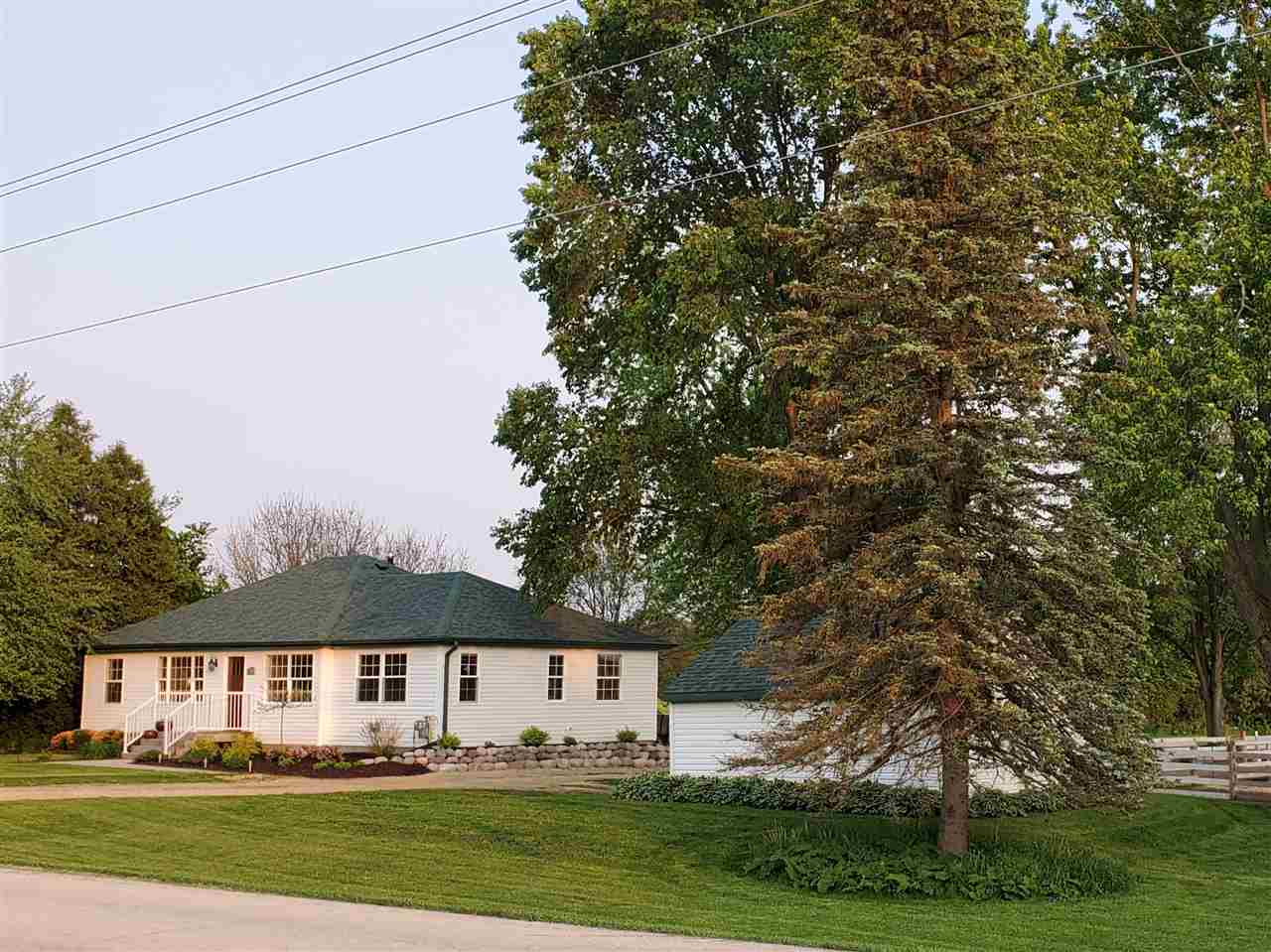 7005 Middle Road South Beloit, IL 61080 - Photo 1 of 39 a front view of a house with a garden