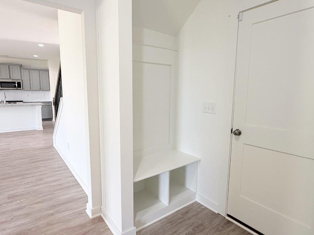 123 Purackal Lane Statham, GA 30666 - Photo 11 of 49 a view of a hallway with wooden floor