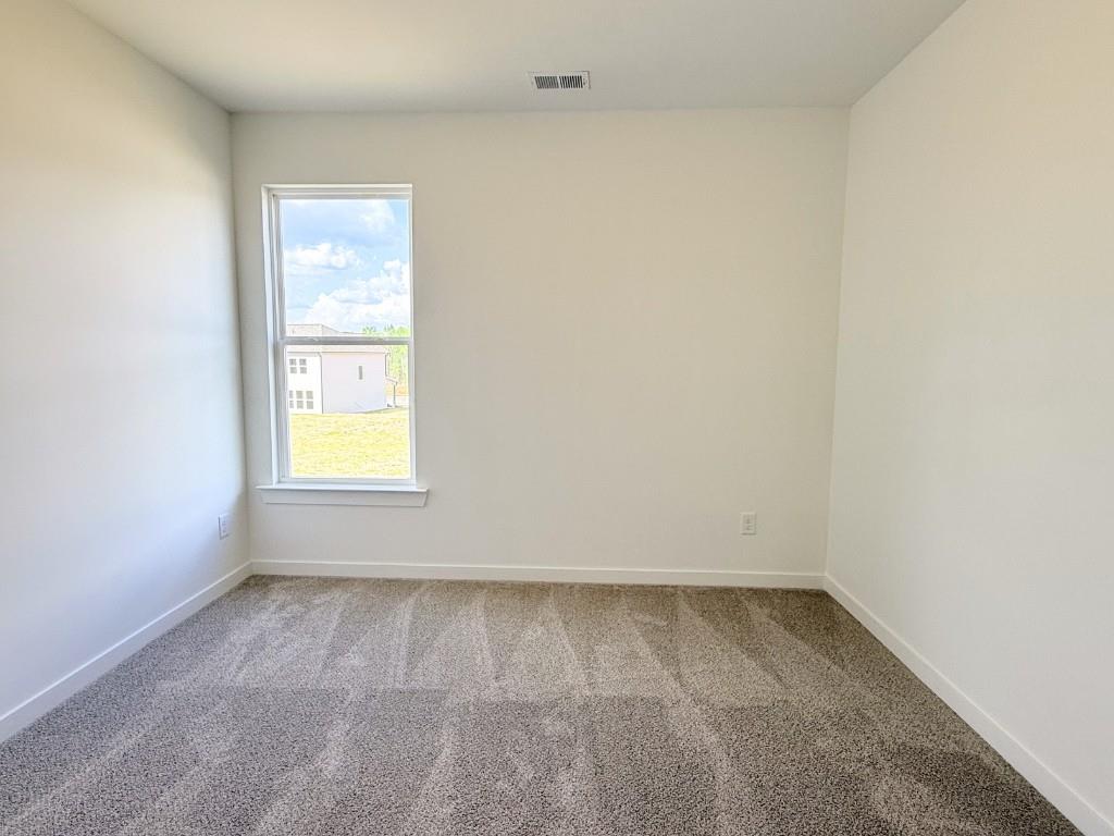 123 Purackal Lane Statham, GA 30666 - Photo 12 of 49 an empty room with a window