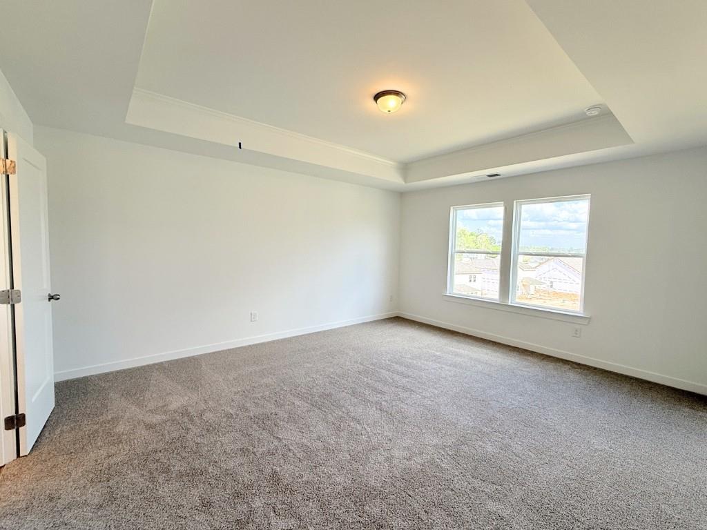 123 Purackal Lane Statham, GA 30666 - Photo 15 of 49 an empty room with windows