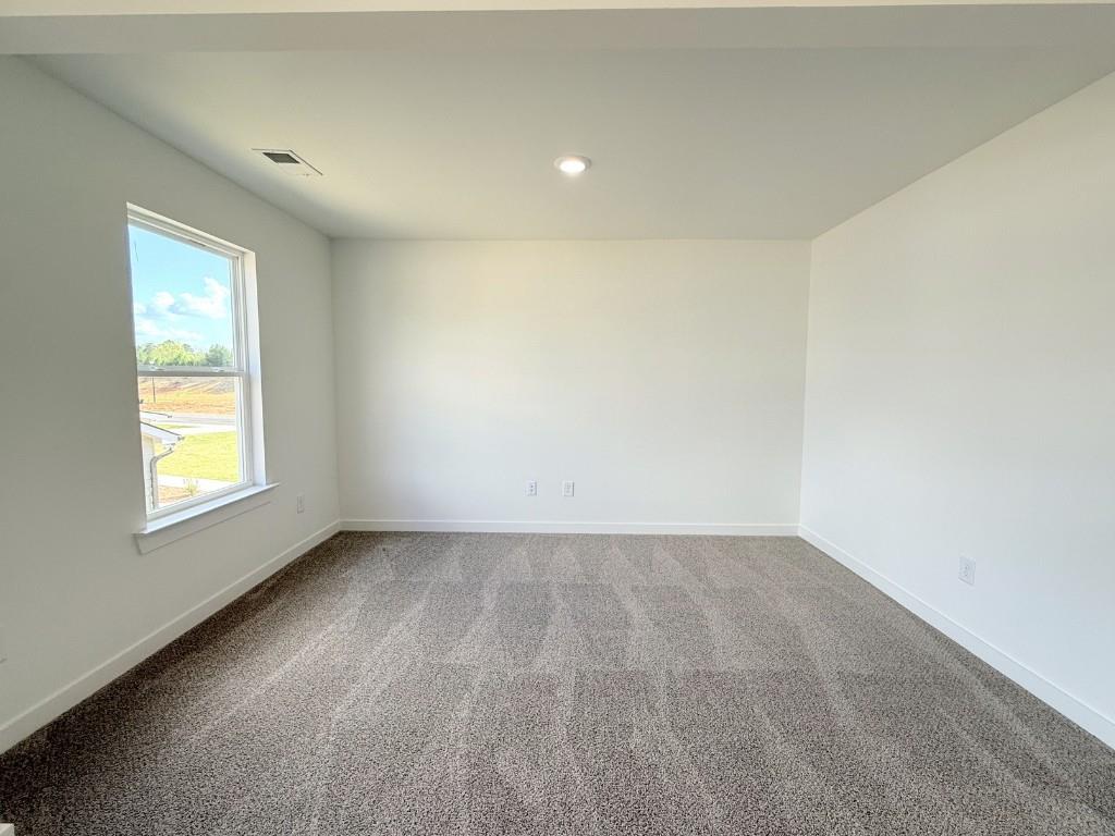 123 Purackal Lane Statham, GA 30666 - Photo 16 of 49 an empty room with windows