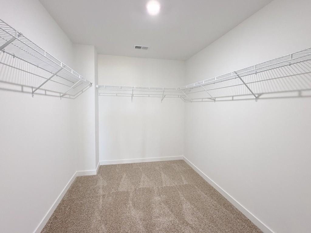 123 Purackal Lane Statham, GA 30666 - Photo 21 of 49 a view of a room with racks on the wall