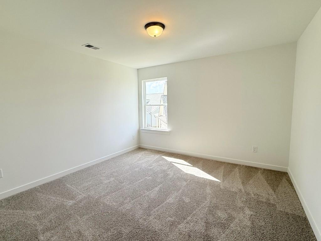 123 Purackal Lane Statham, GA 30666 - Photo 25 of 49 an empty room with windows