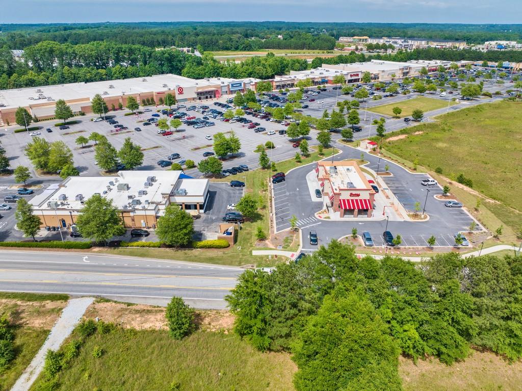123 Purackal Lane Statham, GA 30666 - Photo 48 of 49 an aerial view of a city with lots of residential buildings ocean and mountain view in back