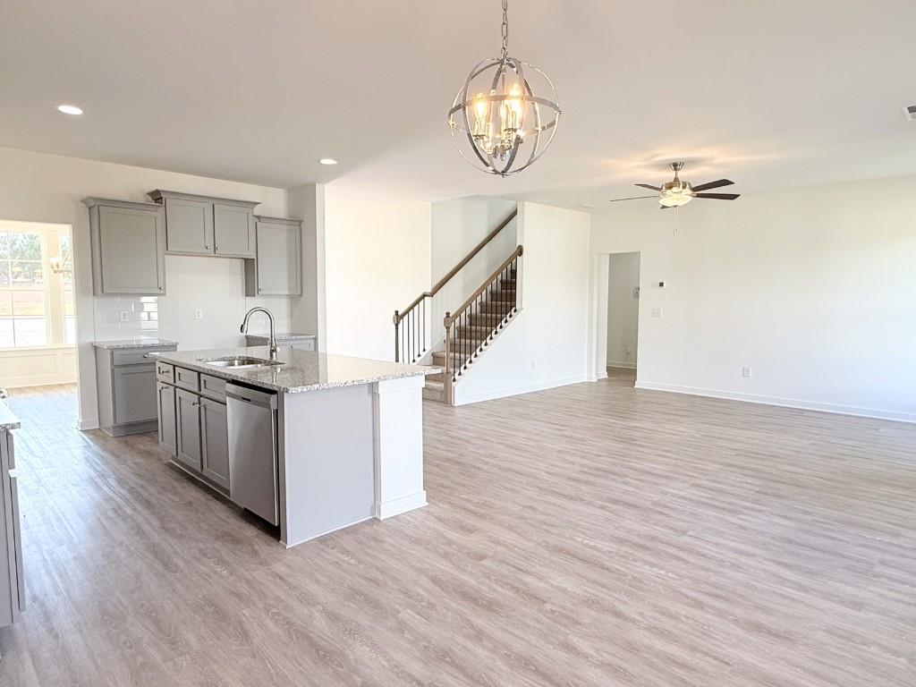 123 Purackal Lane Statham, GA 30666 - Photo 9 of 49 a kitchen with stainless steel appliances granite countertop a white stove top oven and cabinets