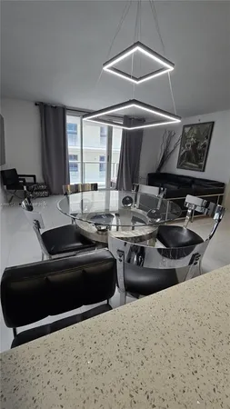 a kitchen with a stove a sink and a refrigerator