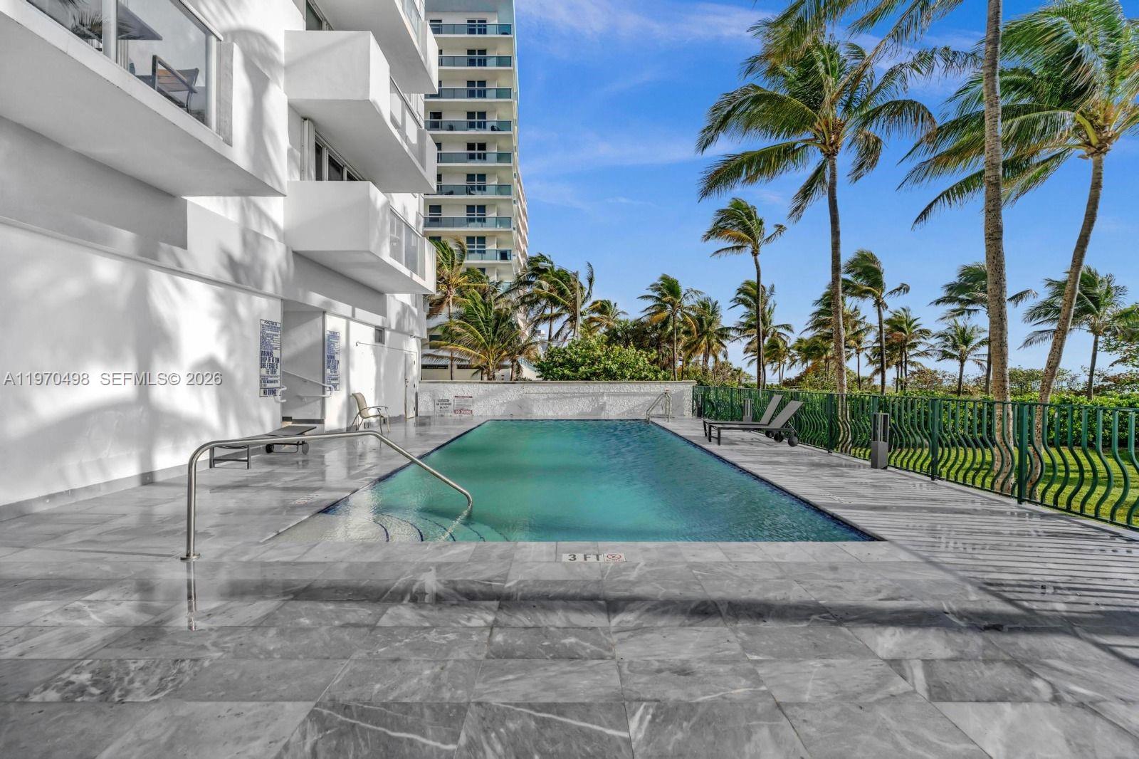 9195 Collins Avenue, Unit 406 Surfside, FL 33154 - Photo 9 of 12 a view of a yard in front of a building