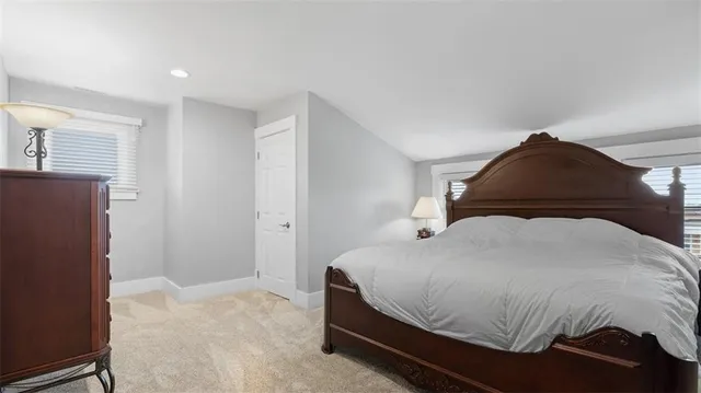 a bedroom with a bed and a cabinets