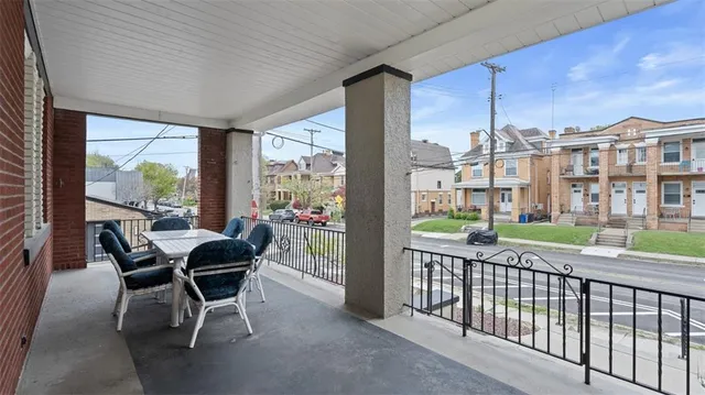 a view of a patio with a table chairs and backyard