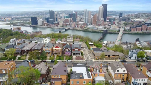 a front view of a residential apartment building with a yard
