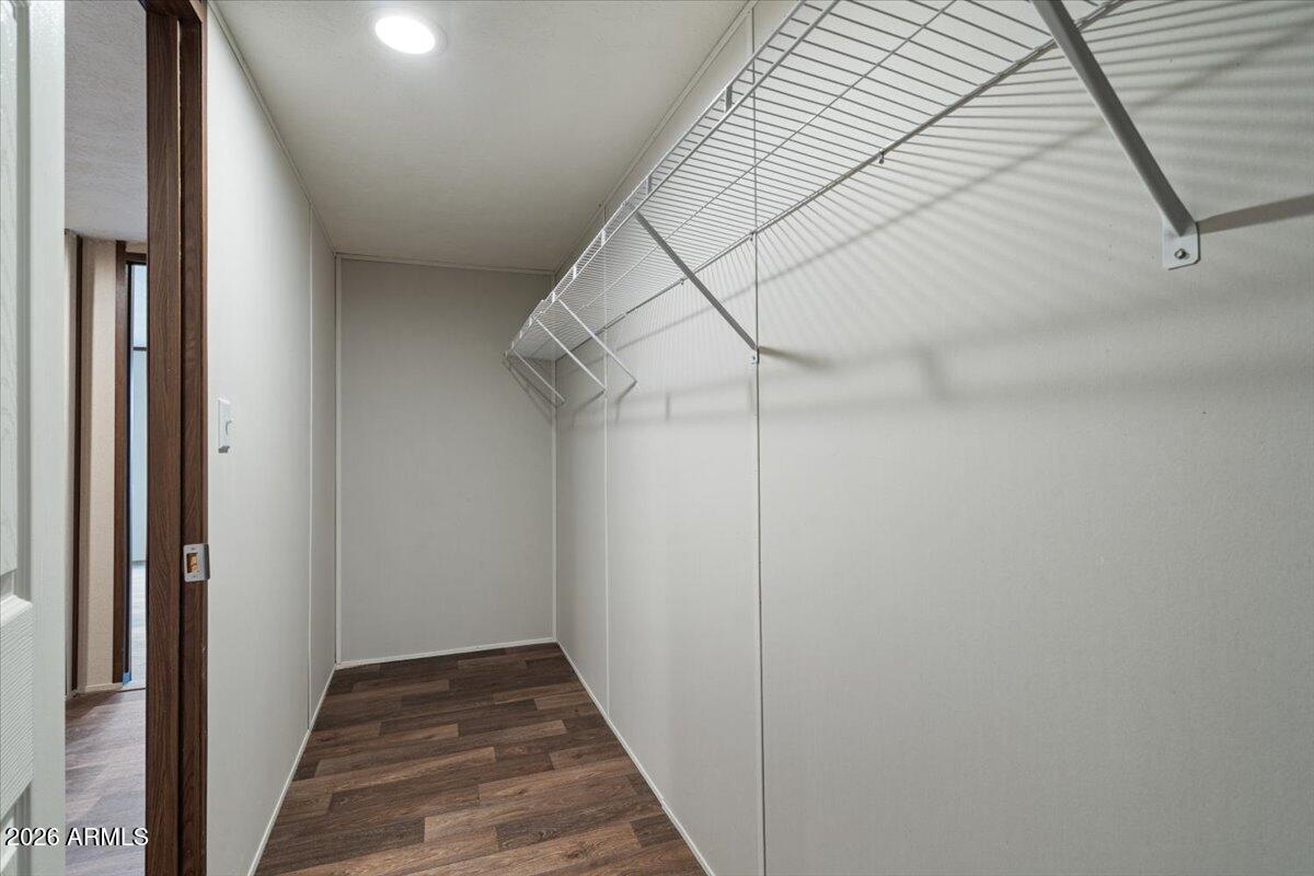 53512 West Organ Pipe Road Maricopa, AZ 85139 - Photo 25 of 44 a view of a hallway with a white walls and stairs