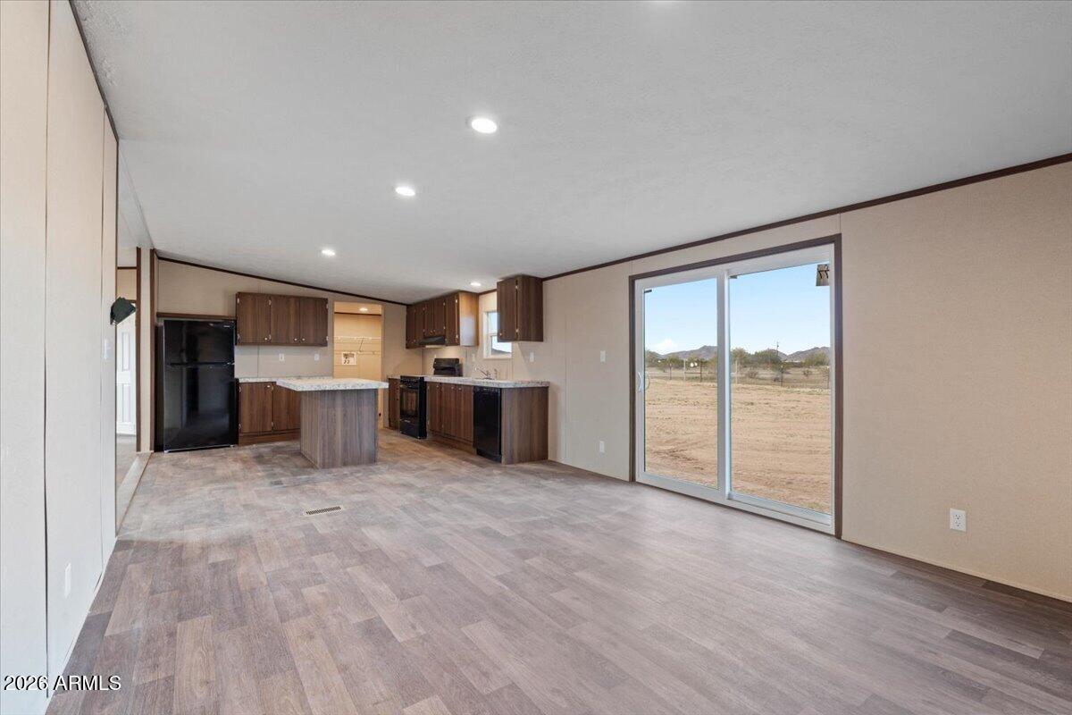 53512 West Organ Pipe Road Maricopa, AZ 85139 - Photo 29 of 44 a view of a kitchen with a sink and a refrigerator