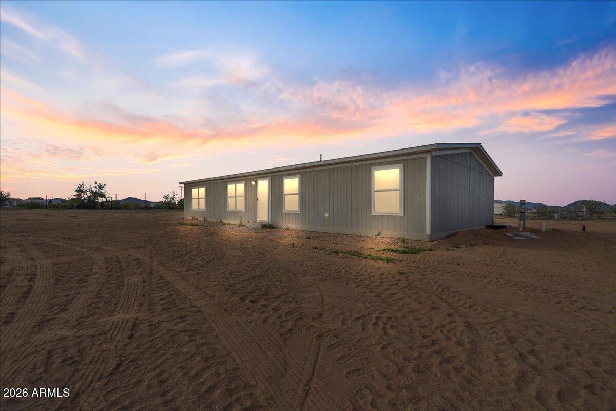 53512 West Organ Pipe Road Maricopa, AZ 85139 - Photo 2 of 44 a view of a house with a yard
